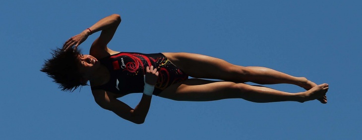 Jie Lian of China dives during the women's 10-meter platform preliminaries. (Al Bello/Getty Images)                                                                                                                                                                       