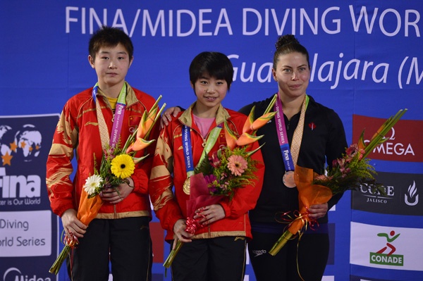 GUADALAJARA, MEXICO - MAY 19: Yajie Si from China silver medal, Huixia Liu form China gold medal and Roseline Filion from Canada bronze medal during the Women's 10 meters Platform Finals of the FINA MIDEA Diving World Series 2013 at Pan American Aquatic Center on May 19, 2013 in Guadalajara, Mexico. (Photo by Hector Vivas/LatinContent/Getty Images)